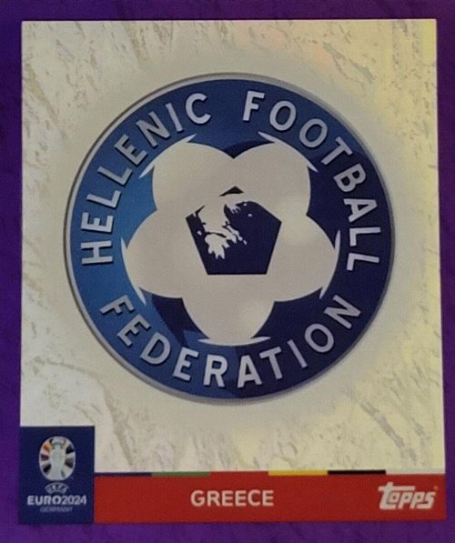 Topps - UEFA Germany Euro 2024 Sticker - GRE 1.
Logo (Greece) - Purple Parallel Foil