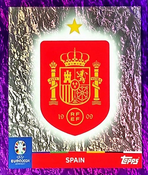 Topps - UEFA Germany Euro 2024 Αυτοκόλλητο - ESP 1.
Logo (Spain) - Purple Parallel Foil